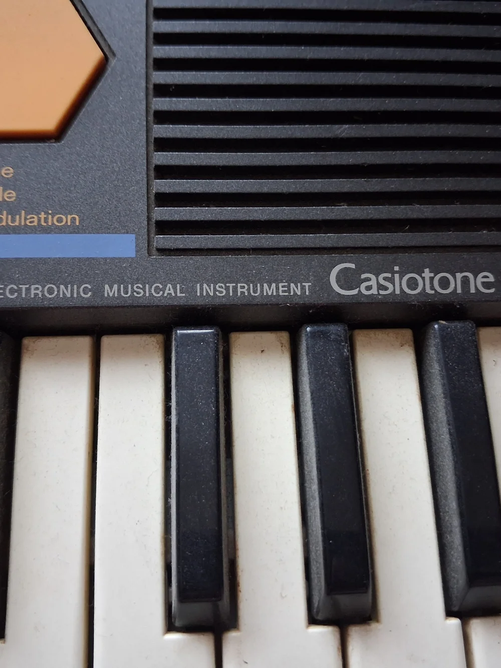 Casio Electronic Keyboard Synthesizer – Black with Orange Accents